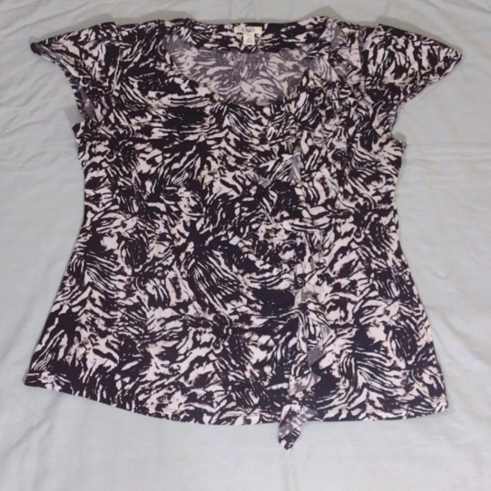 Black and white ruffle front top